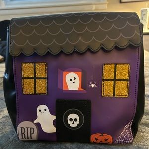 Halloween haunted house themed backpack purse.